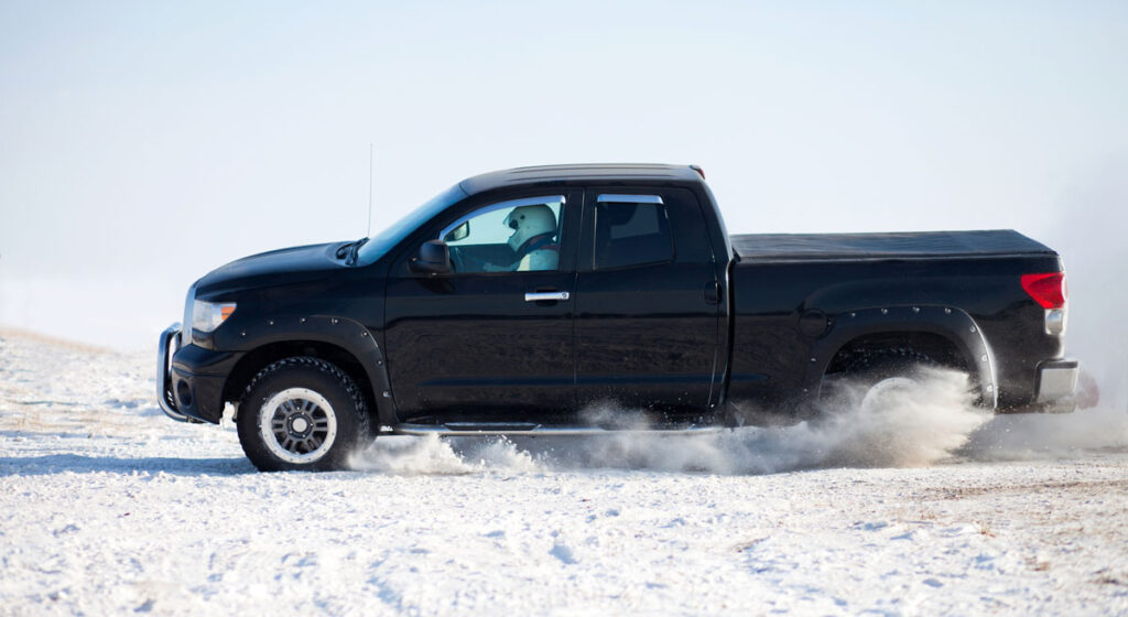 View of a Toyota Tundra traveling in a snowy road