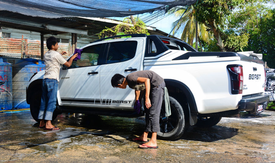 View of two people doing car wash